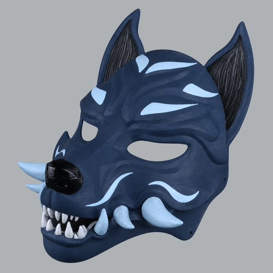 Kitsune fox mask with fangs in Dark Indigo / Ice Blue — three-quarter view facing left
