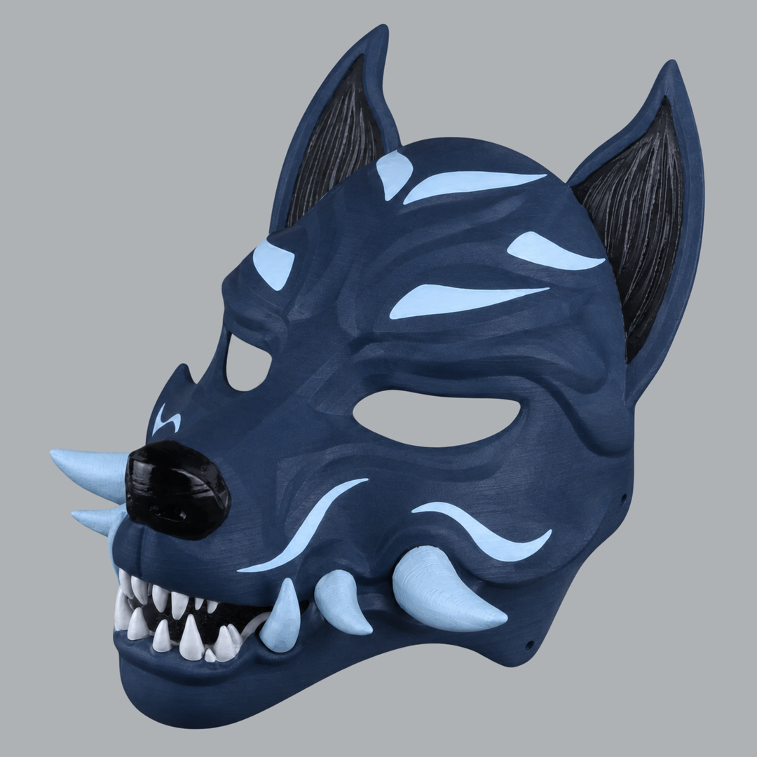 Kitsune fox mask with fangs in Dark Indigo / Ice Blue — three-quarter view facing left