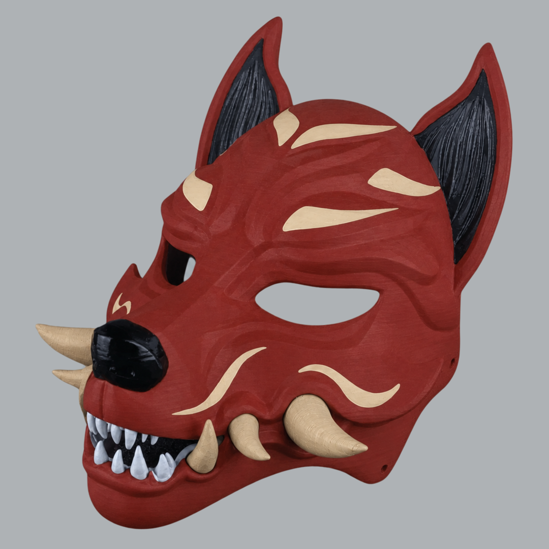 Kitsune Fox Mask With Fangs - Rust / Beige, three-quarter view with the nose pointing left