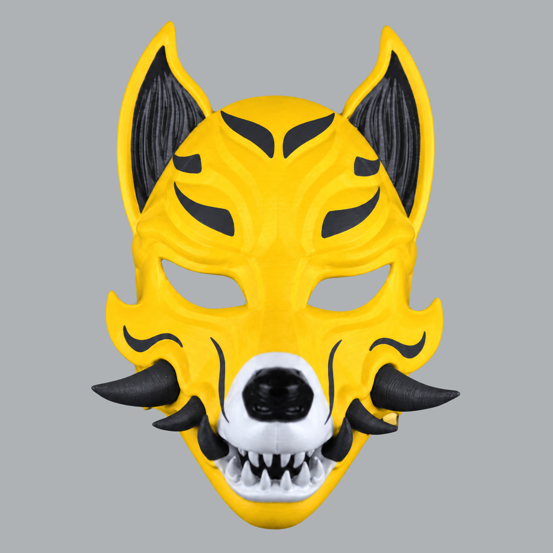 Yellow / Slate kitsune fox mask with fangs, elevated frontal view showing pointed ears and teeth