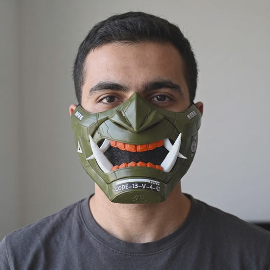 Cyberpunk Oni Mask - Olive Green / Shock Orange worn on a model
